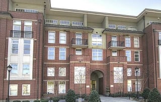 Brick condo building with patios