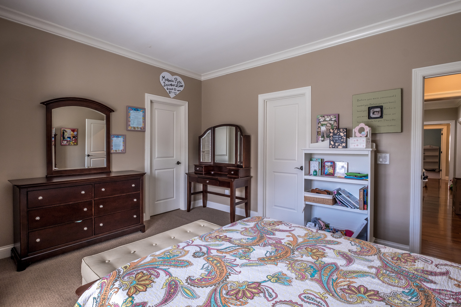 Bedroom with brown walls white trim light brown carpets