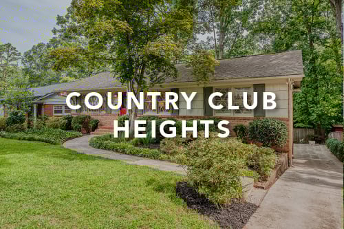 Home with brown brick on the bottom half and green shingles on the top half with green shutters and the words Country Club Heights typed over the image