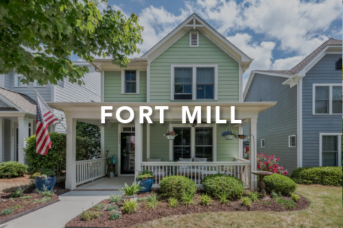 Fort Mill Green siding home with front porch landscaped front yard and white details with the words Fort Mill typed over the image