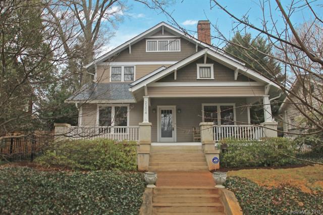 Home with gray siding and gray shingles large front porch with stairs leading to front door