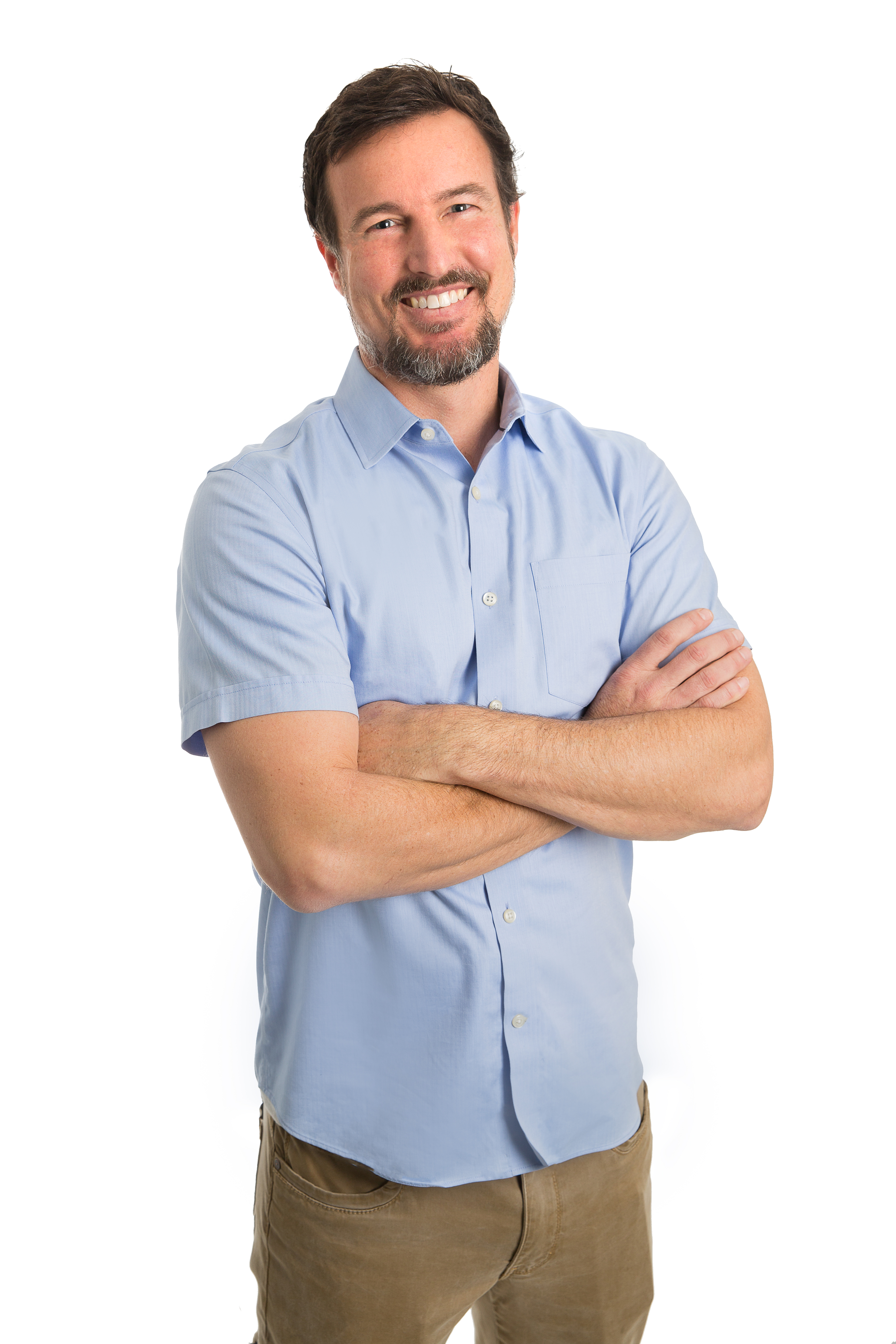 Jeff King_Full Body Full length Jeff King wearing a blue short sleeved button down shirt and khaki pants