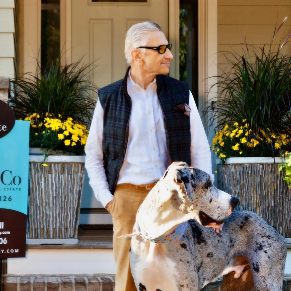 Les Harrell and Bruiser_2 Les Harrell wearing khaki pants a white button down and tartan vest standing with his Great Dane Bruiser